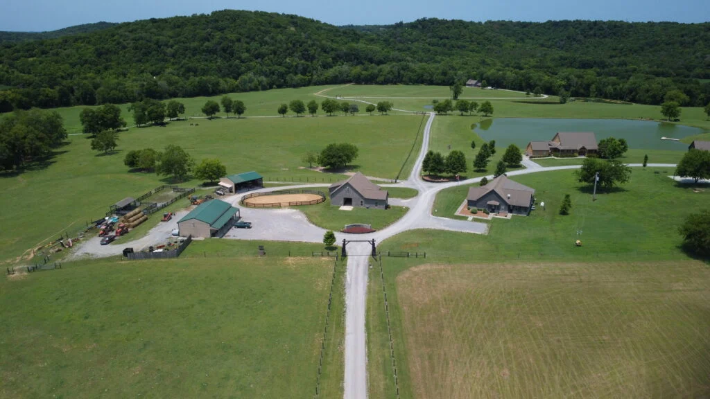 Aerial view of the lake and fields at Riverbend Ranch